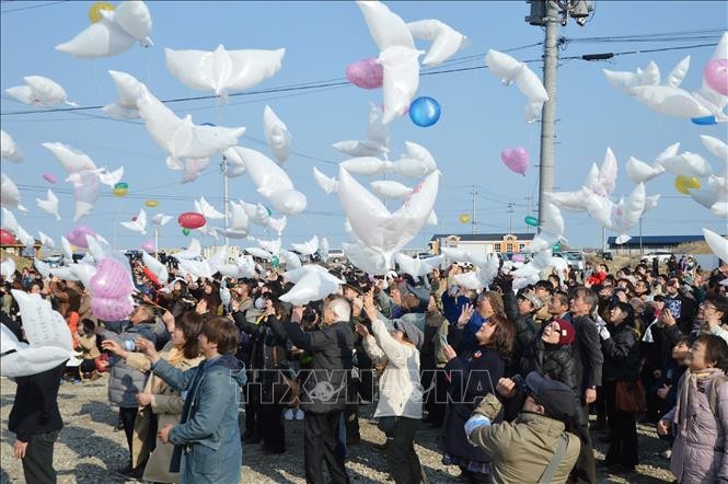 Lễ tưởng niệm các nạn nhân động đất- sóng thần 2011 tại Miyagi, Nhật Bản, ngày 11/3/2018. Ảnh tư liệu: AFP/TTXVN