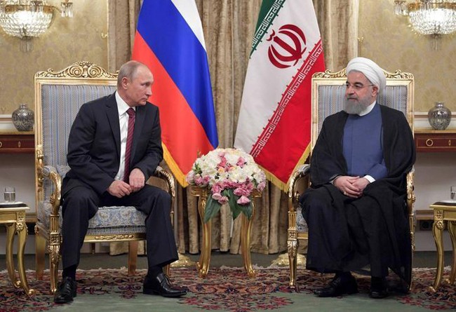 Tổng thống Nga Vladimir Putin (phải) và Tổng thống Iran Hassan Rouhani. Ảnh: Reuters