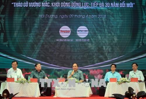 Thủ tướng Nguyễn Xuân Phúc phát biểu tại buổi đối thoại với nông dân Việt Nam với chủ đề "Tháo gỡ vướng mắc, khơi dòng động lực, tiếp đà 30 năm đổi mới” ngày 09/04/2018. Ảnh: Thống Nhất/TTXVN