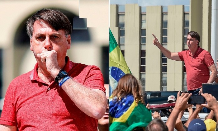 Tổng thống Jair Bolsonaro không đeo khẩu trang khi diễn thuyết trước đám đông phản đối phong tỏa và giãn cách xã hội tại Brazil hồi tháng 4. (Nguồn: Dailymail)