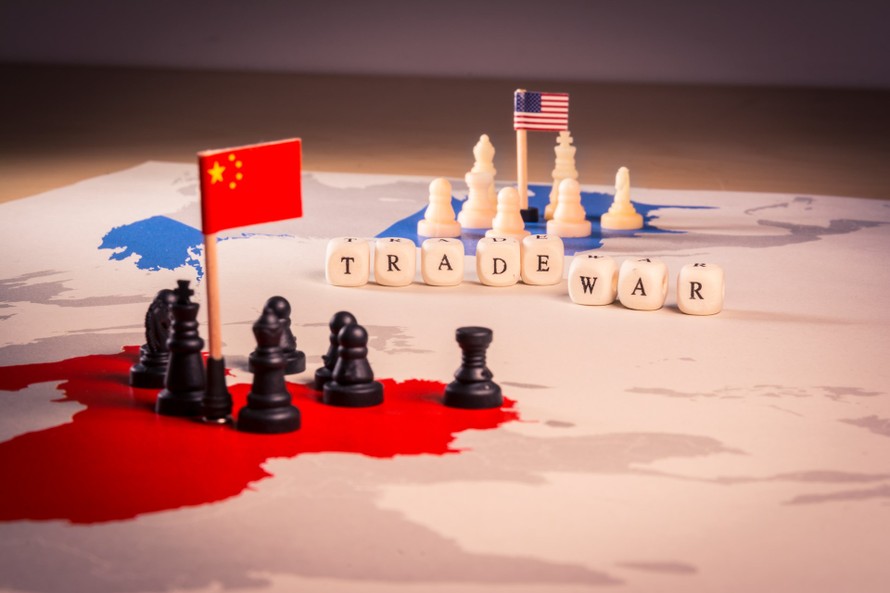 Xung đột thương mại Mỹ - Trung ảnh hưởng tiêu cực tới hoạt động kinh doanh của doanh nghiệp châu Âu. (Nguồn: AFP)