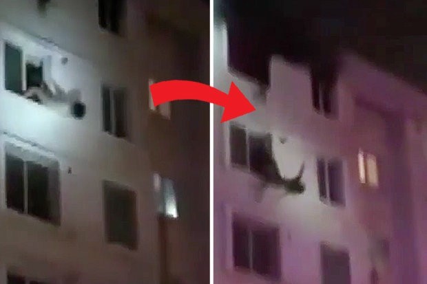 Hai phụ nữ bị rơi khỏi cửa sổ tầng 6 tòa nhà cao tầng may mắn thoát chết nhờ được lính cứu hỏa giữ lại. Ảnh chụp màn hình.