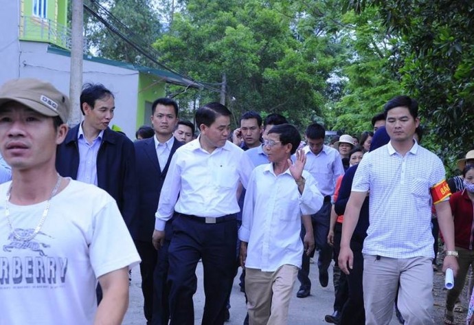 Ảnh/baogiaothong. Chủ tịch UBND TP Hà Nội Nguyễn Đức Chung tại "điểm nóng" Đồng Tâm