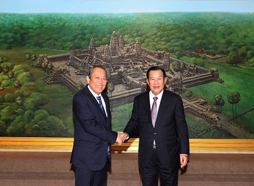 Phó Thủ tướng Thường trực Trương Hòa Bình và Thủ tướng Campuchia Samdech Hun Sen - Ảnh: VGP/Lê Sơn