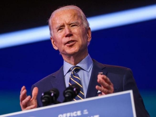 Tổng thống tân cử Mỹ Joe Biden phát biểu hôm 28-12 tại văn phòng nhóm chuyển tiếp quyền lực. Ảnh: REUTERS