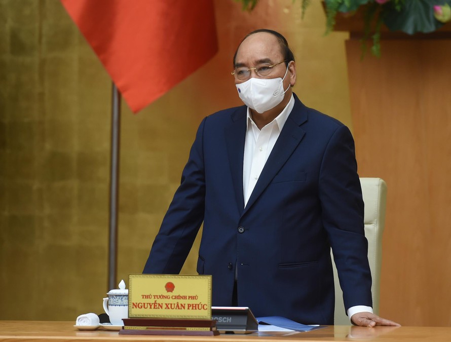 Thủ tướng Nguyễn Xuân Phúc phát biểu kết luận cuộc họp Thường trực Chính phủ về công tác phòng chống dịch COVID-19. Ảnh: VGP/Quang Hiếu