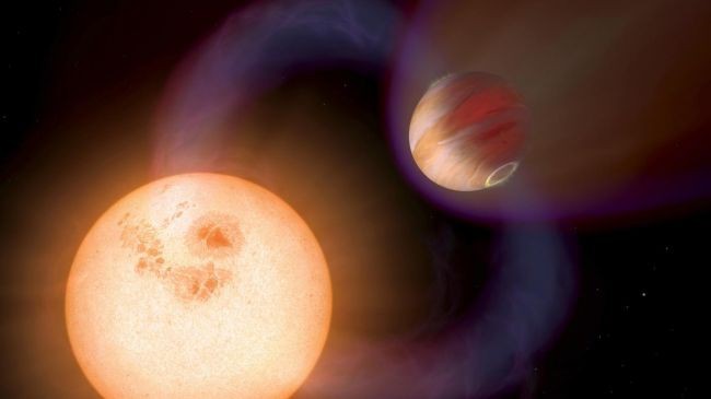 Ảnh mô phỏng hệ hành tinh nơi có một phiên bản Sao Mộc quay quanh "mặt trời cam" - Ảnh: NASA/ESA