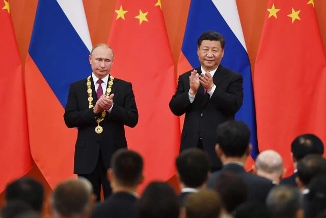 Tổng thống Nga Vladimir Putin và Chủ tịch Trung Quốc Tập Cận Bình. (Ảnh: AFP)