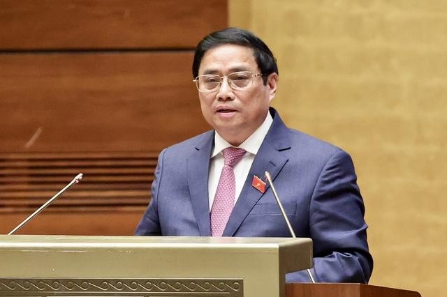 Thủ tướng Phạm Minh Chính trình bày Báo cáo kết quả thực hiện kế hoạch phát triển kinh tế-xã hội năm 2022; dự kiến kế hoạch phát triển kinh tế-xã hội năm 2023 - Ảnh: VGP