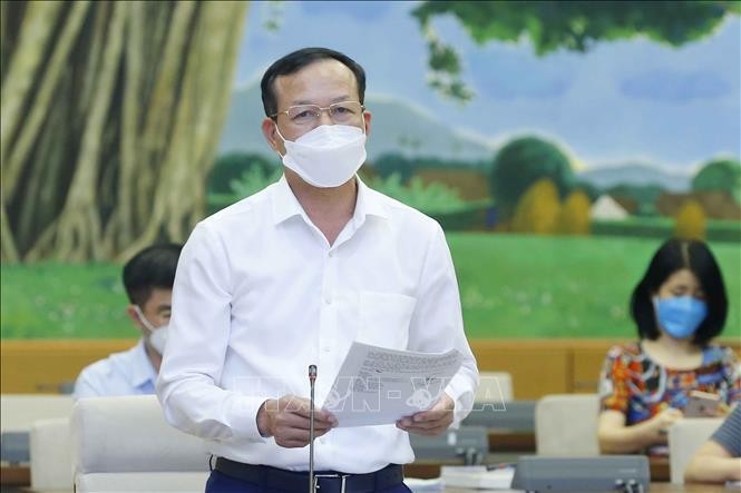 Phó Chánh án Tòa án nhân dân tối cao Nguyễn Trí Tuệ trình bày văn bản. Ảnh: Doãn Tấn/TTXVN